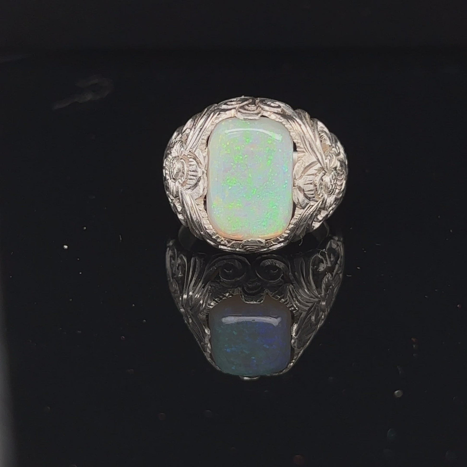 One off perfectly crafted silverwork finished with a beautiful cushion cut Coober Pedy crystal opal showing awesome greens.