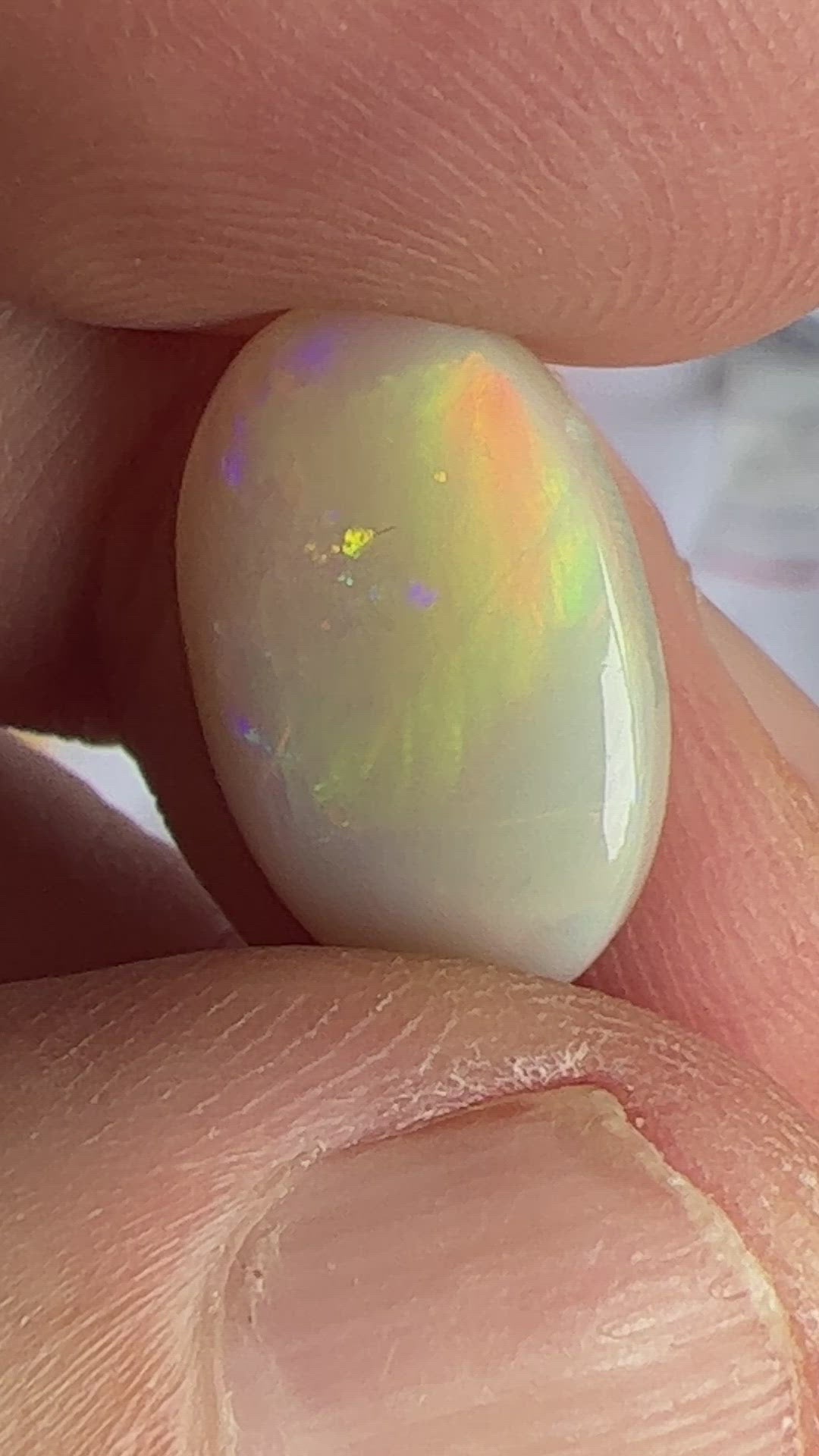 Beautiful rare Mintabie oval solid opal, displaying magnificent purple, blue, green and orange. Ready to set.