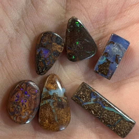 Nice group of 6 Winton boulder opals. Nice cut and polish.