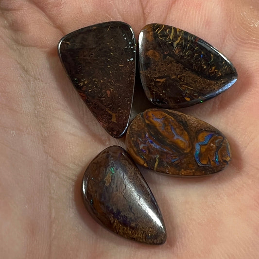 Four delightful pieces of boulder opal from Winton. Nice sparkles and polish.
