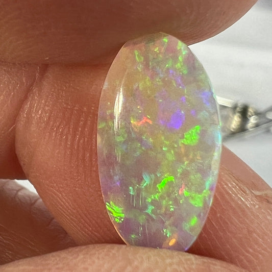 Perfect Lightning Ridge crystal opal displaying magnificent colours. Both sides are polished. Cut by Bill Johnston.