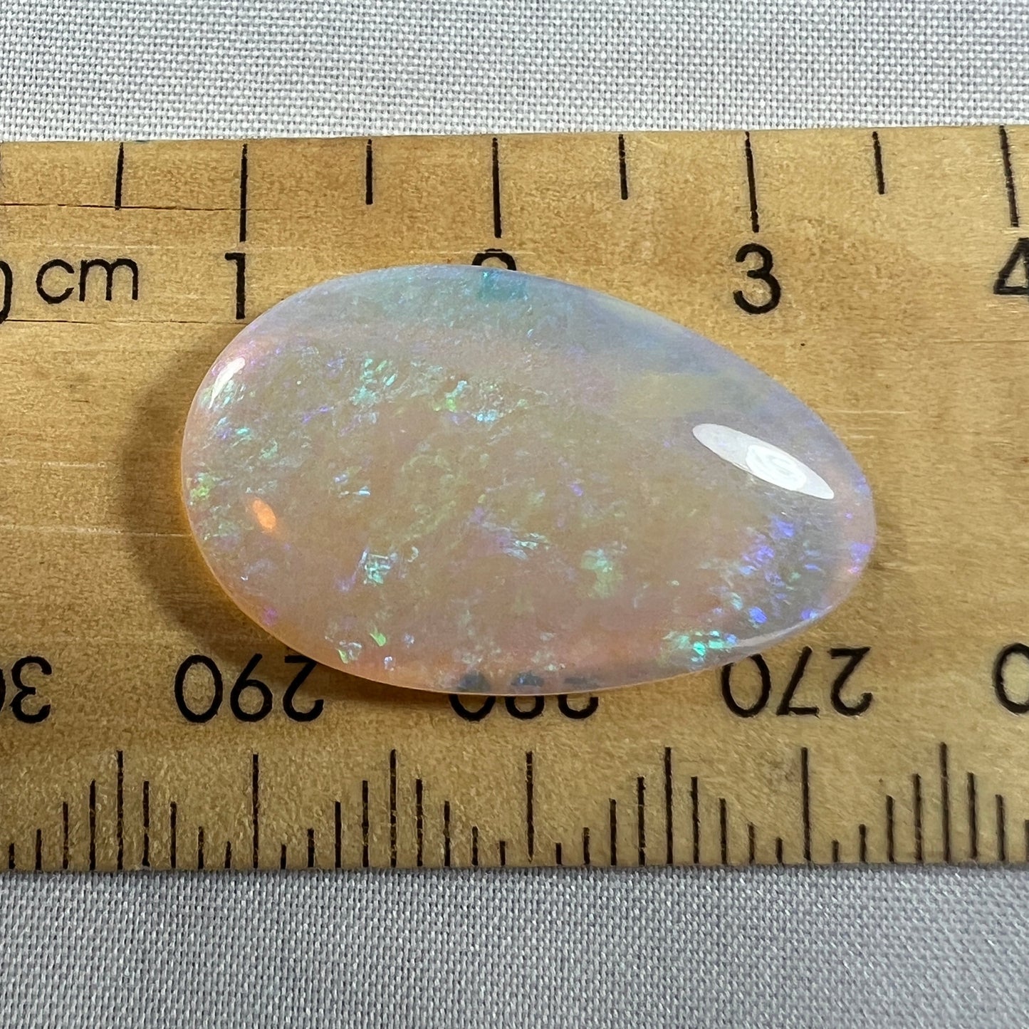 You will not find a better Lightning Ridge crystal opal than this one. Expertly cut and polished by Bill Johnston. Ready to go.
