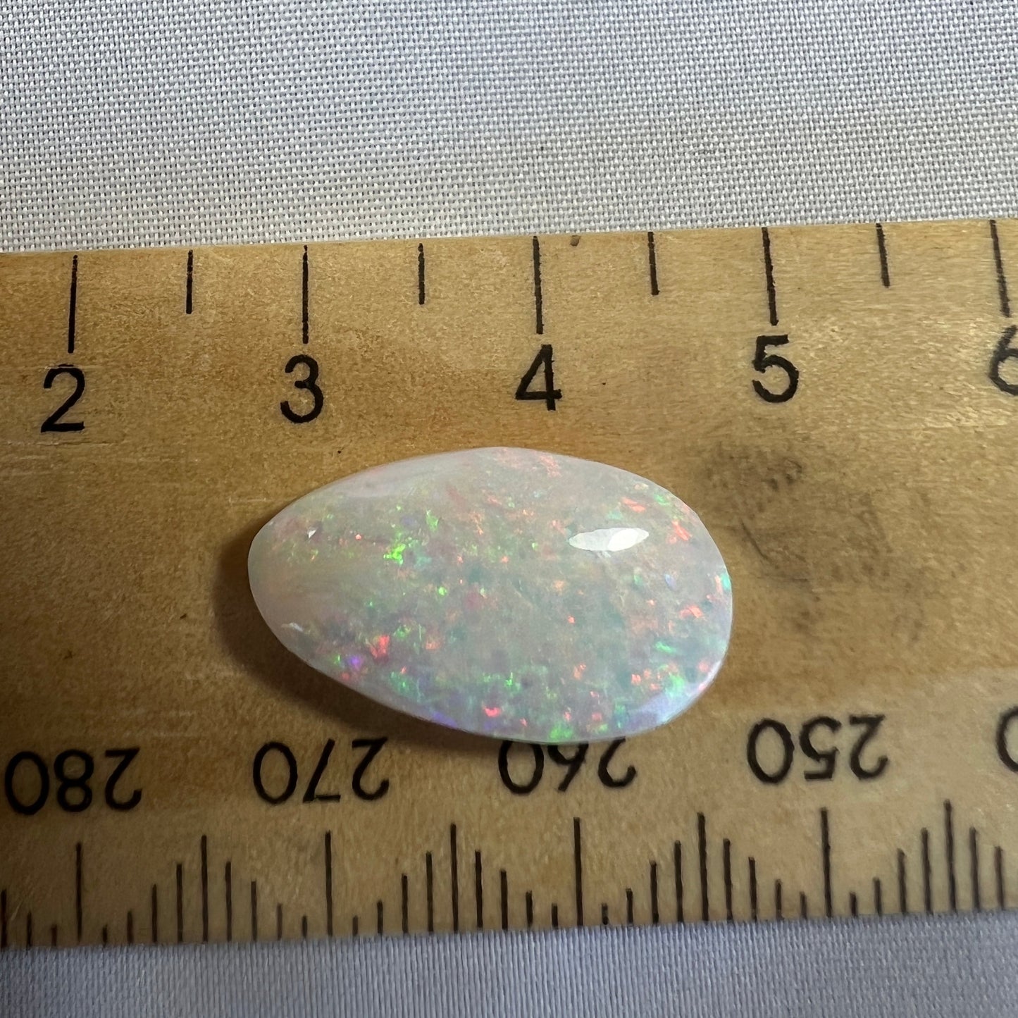Wonderful pin fire Coober Pedy solid white opal. Bright and beautifully cut by Bill Johnson.
