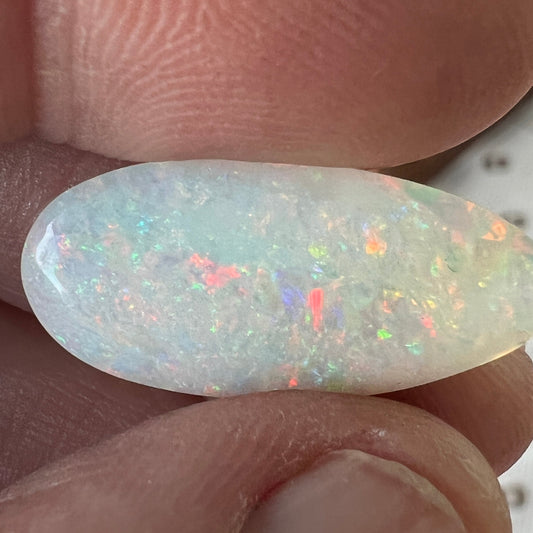 Beautiful 9.1ct Coober Pedy solid white opal. Double sided and showing all the colours. Cut and polished by Bill Johnson.