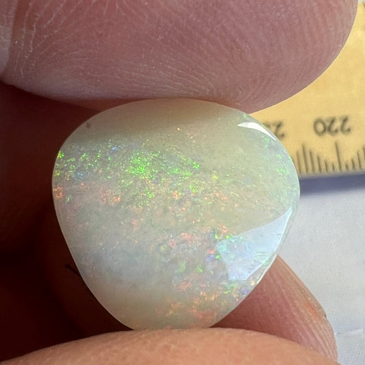 Nice Coober Pedy pin fire solid white opal. Interesting shape, ready for a ring or pendant. Cut and polished by Bill Johnson.