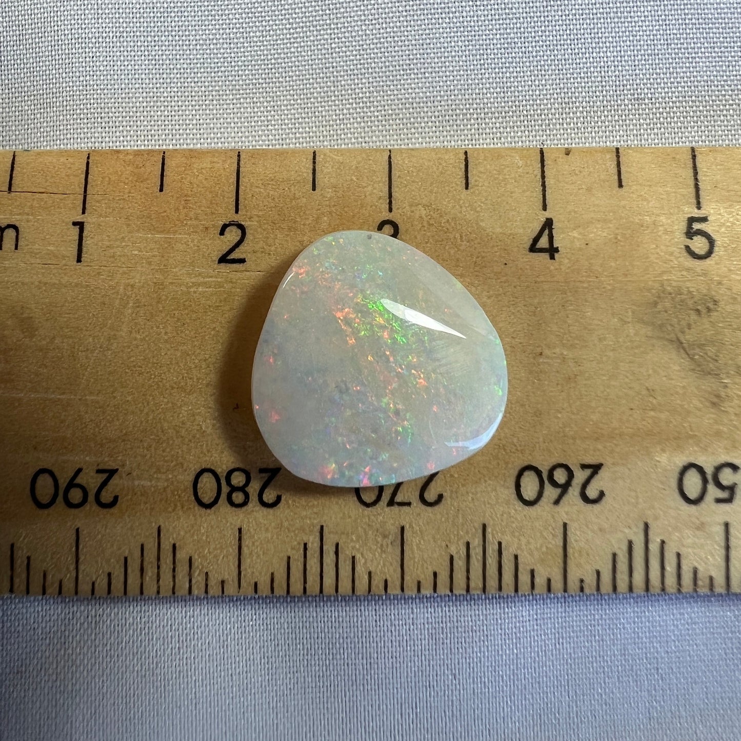Nice Coober Pedy pin fire solid white opal. Interesting shape, ready for a ring or pendant. Cut and polished by Bill Johnson.