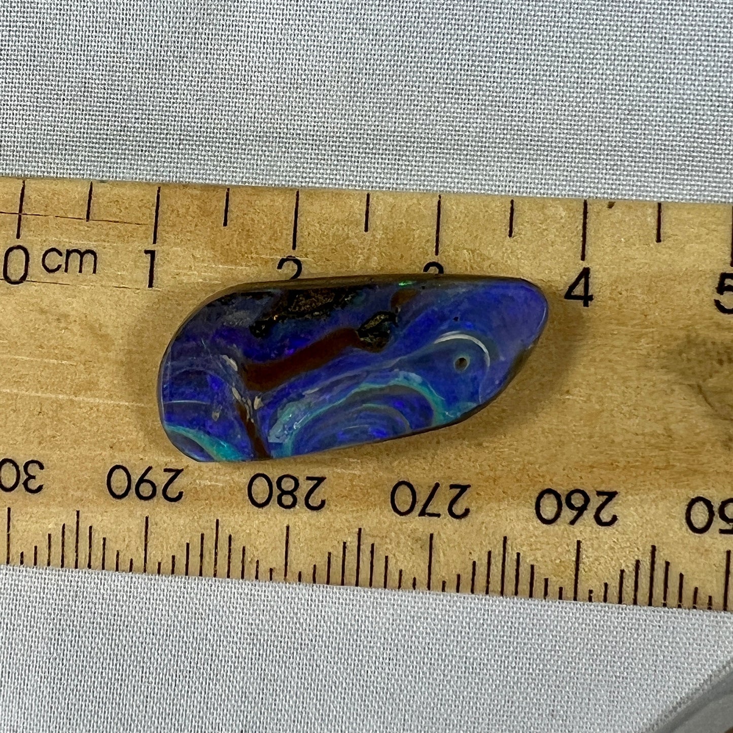 Bright and bold colours and awesome patterns in this beautiful piece of boulder opal from Winton. Nicely polished and a perfect pendant.