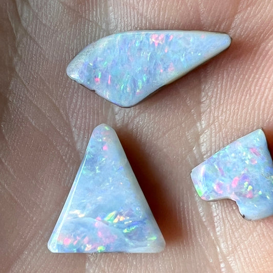 Three beautiful pieces of boulder opal from Eromanga, Queensland. Nice pin fire pattern displaying reds and greens.
