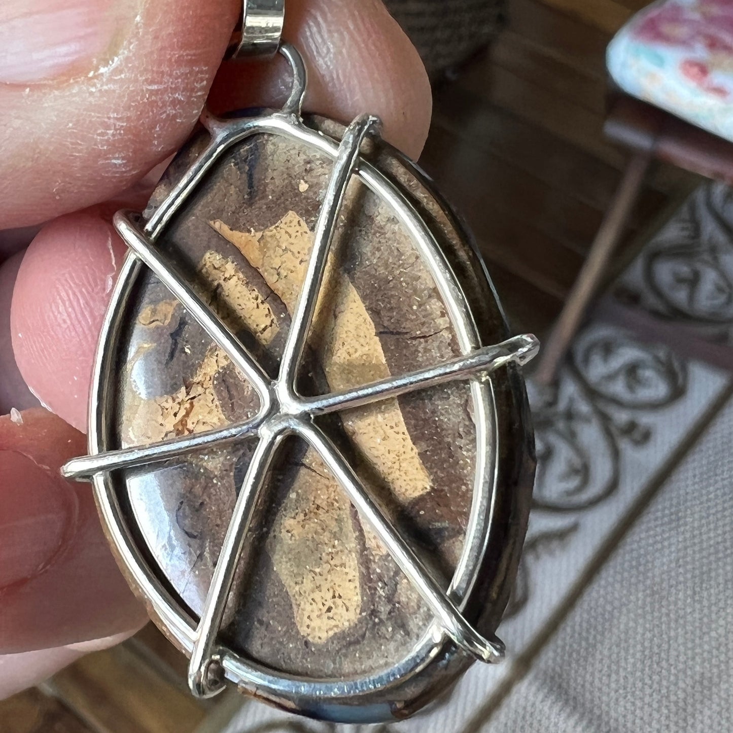 Beautiful example of Winton Boulder opal with an expert polish. Custom made silver mount. A lovely piece.