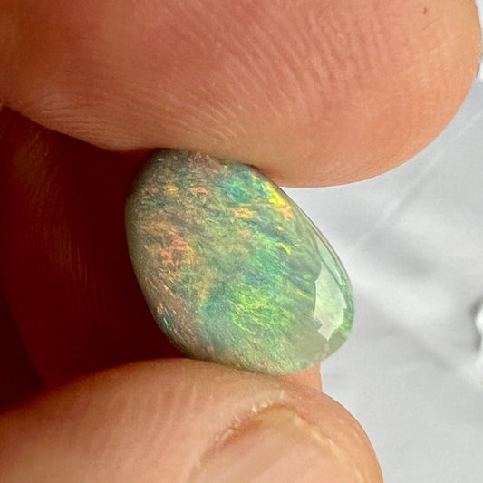 This solid semi black opal from Lightning Ridge displays fantastic colours. Cut, polished, and ready to set.