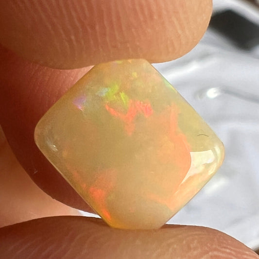 Beautiful Lightning Ridge cushion cut stone. Top polished wonderfully. Full of colour.
