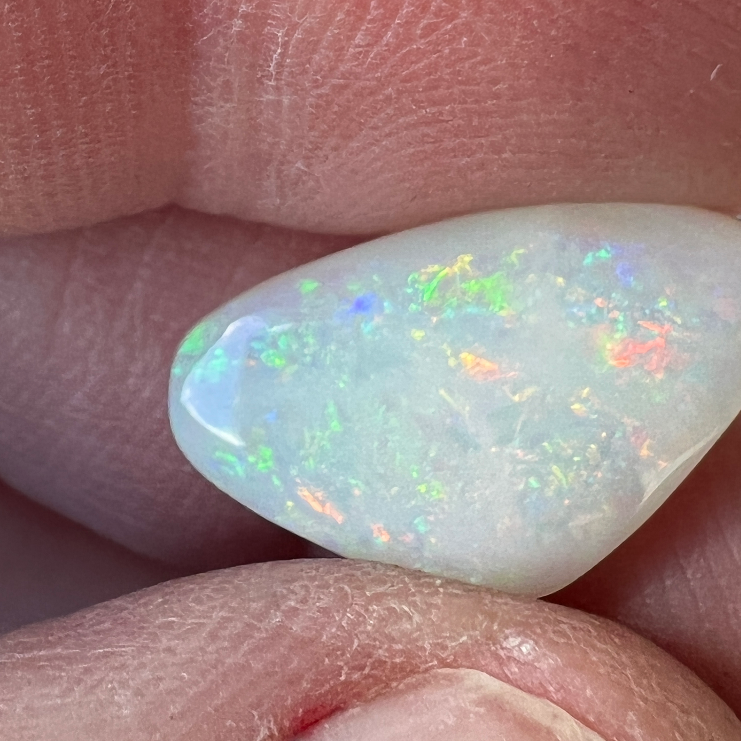 Nice piece of Coober Pedy white opal. Lots of colours showing and a great polish.