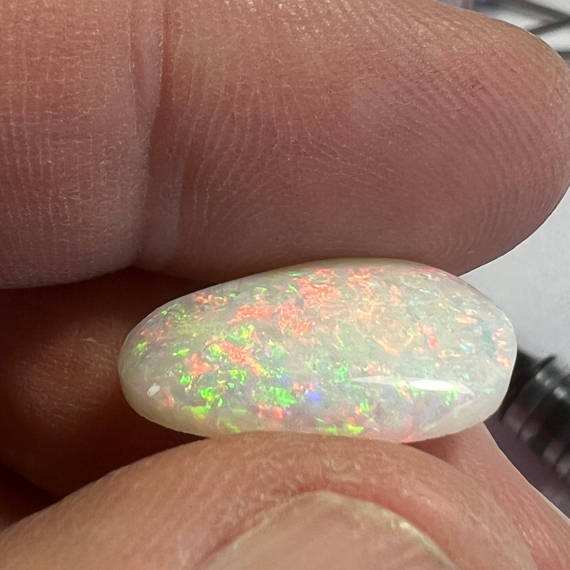 Wonderful pin fire Coober Pedy solid white opal. Bright and beautifully cut by Bill Johnson. 