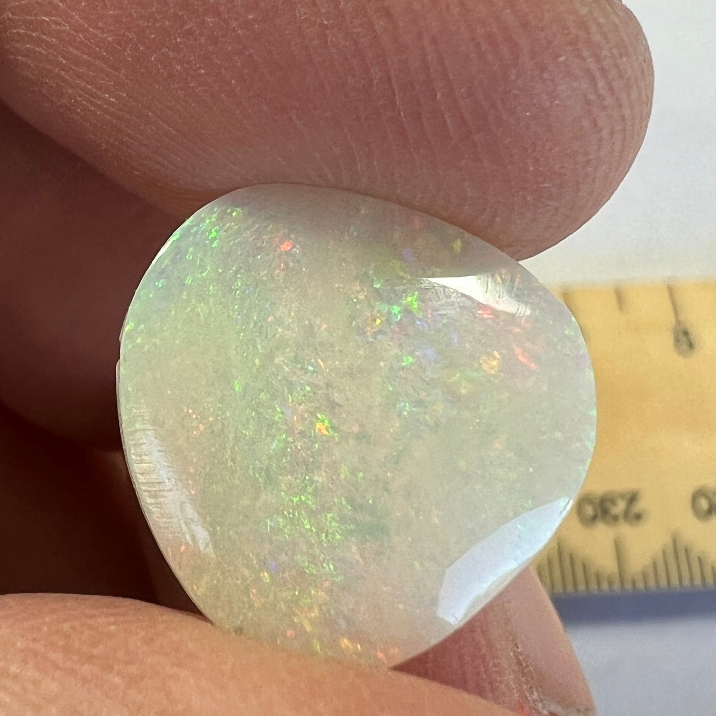 Nice Coober Pedy pin fire solid white opal. Interesting shape, ready for a ring or pendant. Cut and polished by Bill Johnson.